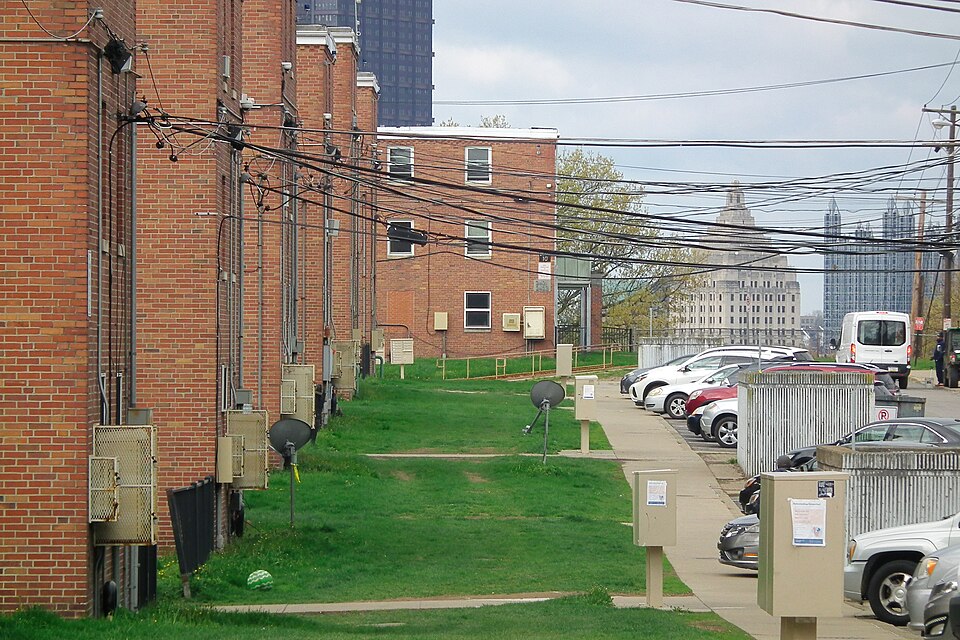 Bedford Dwellings with skyscrapers in the background