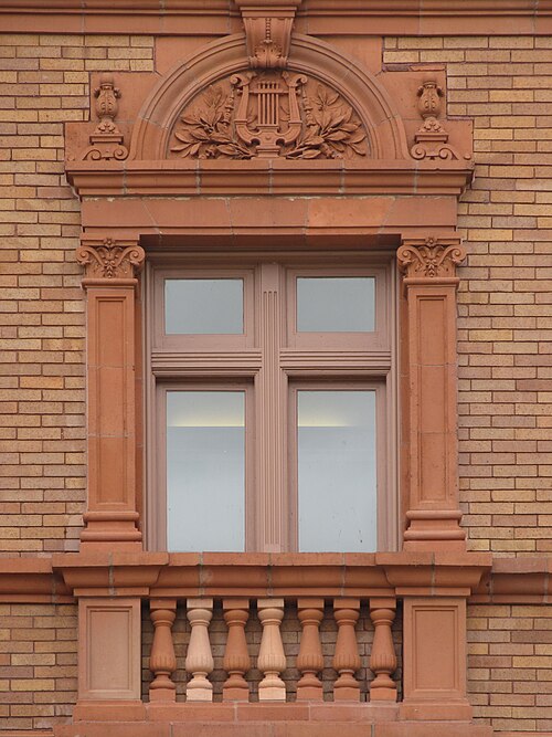 Window of the Music Hall, with terra-cotta lyre
