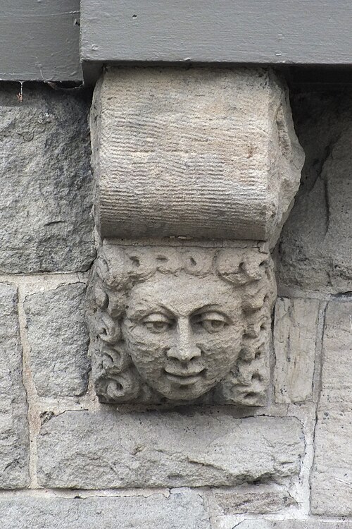 Bracket with carved face