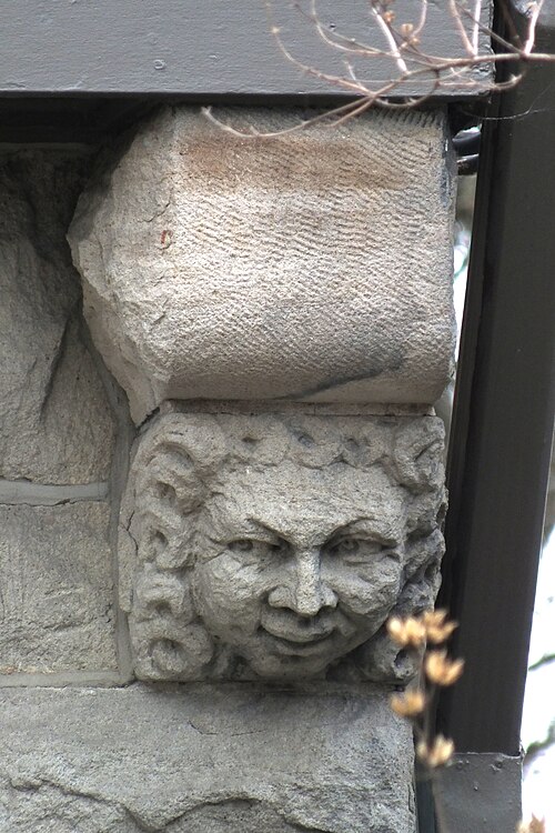 Bracket with carved face