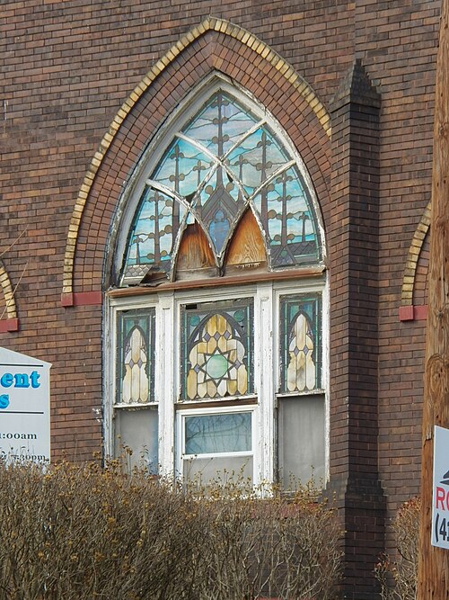 Damaged stained-glass window