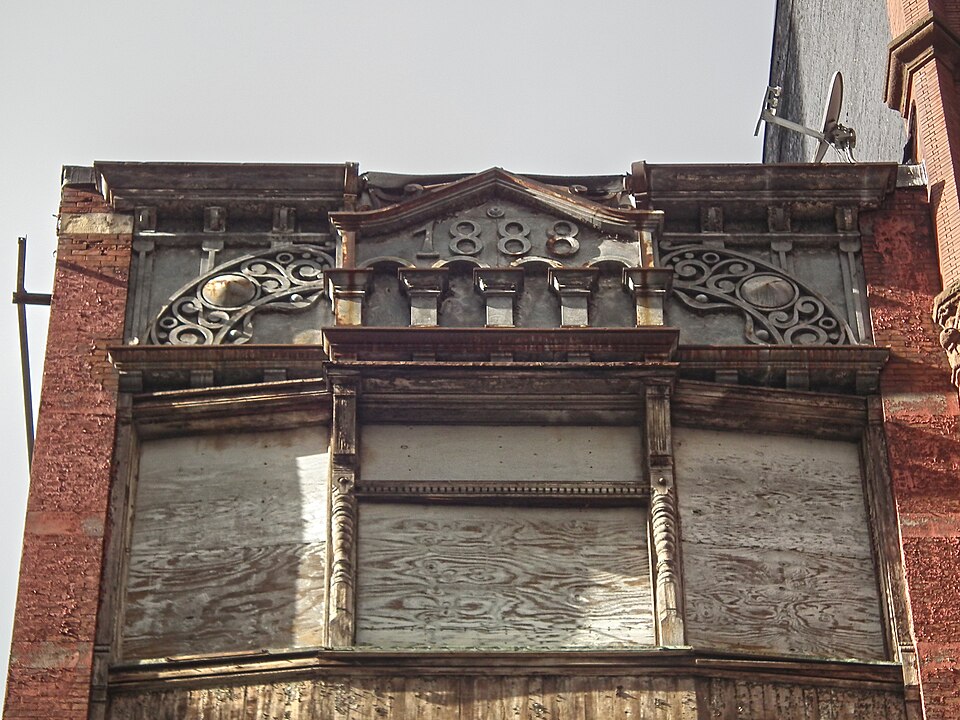 Top of the building qith 1883 date stone