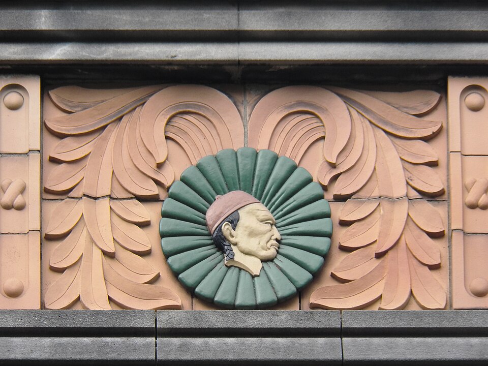 Asian head in terra cotta