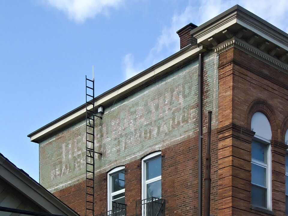 Ghost sign: Heselbarths Real Estate—Insurance, painted over West End Savings Bank & Trust Co.