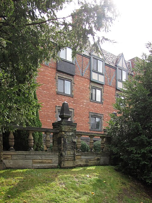 Glimpse of Bellevue Gables through the trees