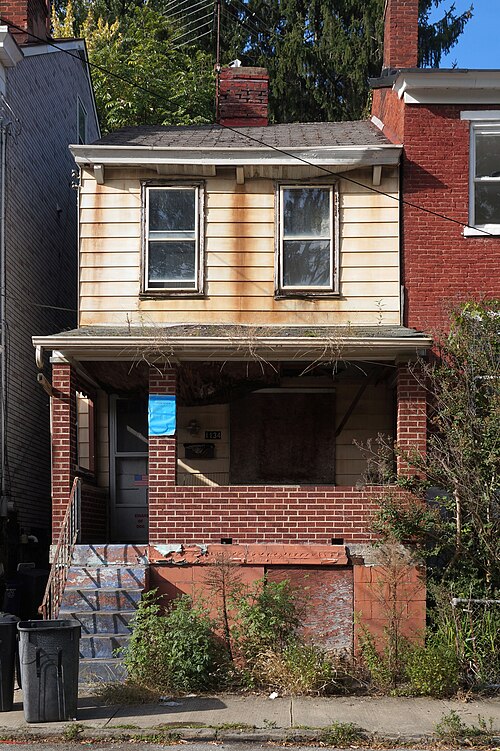 House on High Street with rust-covered aluminum