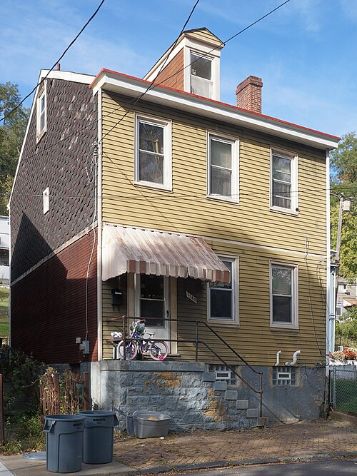 House with three kinds of siding